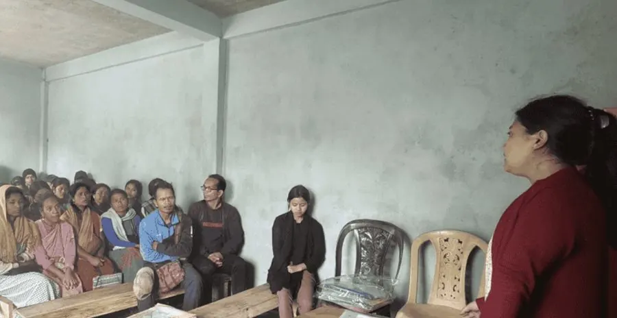 An instructor addressing a classroom of learners in Mawkyrwat